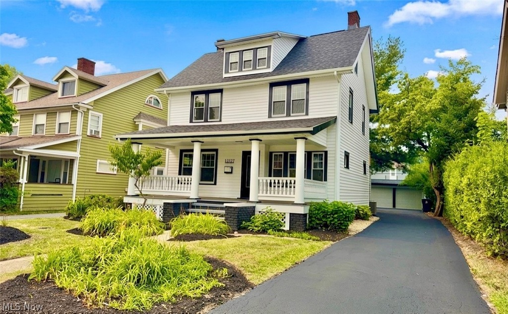 Craftsman home with front porch at 13127 Cedar Rd, Cleveland, Ohio