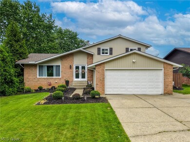 Brick and beige split-level at 7739 Hoertz Rd, Cleveland, Ohio