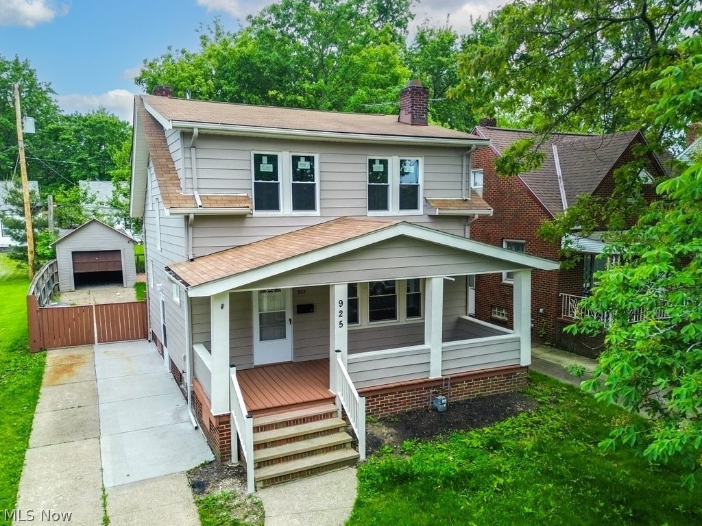 Two-story home with porch at 925 E 224th St, Euclid, Ohio
